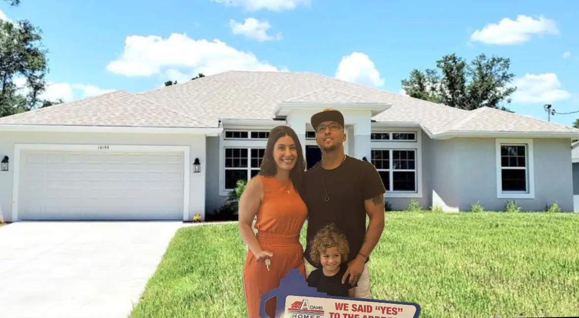 A family celebrating their Adams Homes purchase