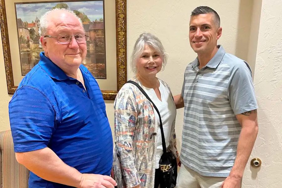 Robert with a smiling couple after their closing