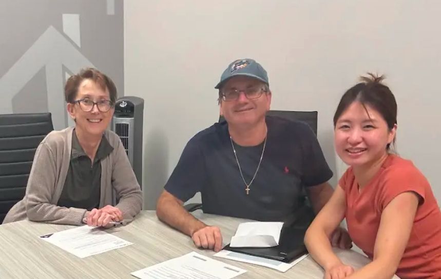 Buyers smiling at the closing table