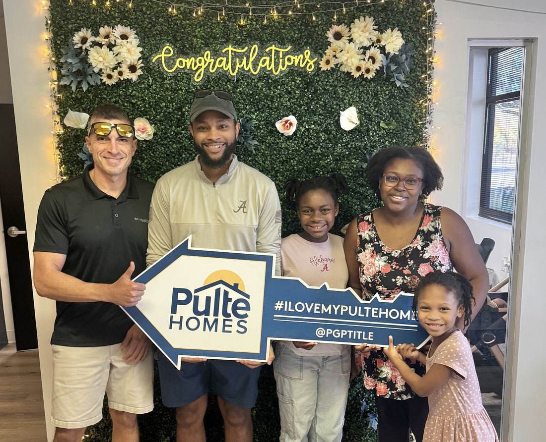 A family celebrating their Pulte Homes closing with Robert