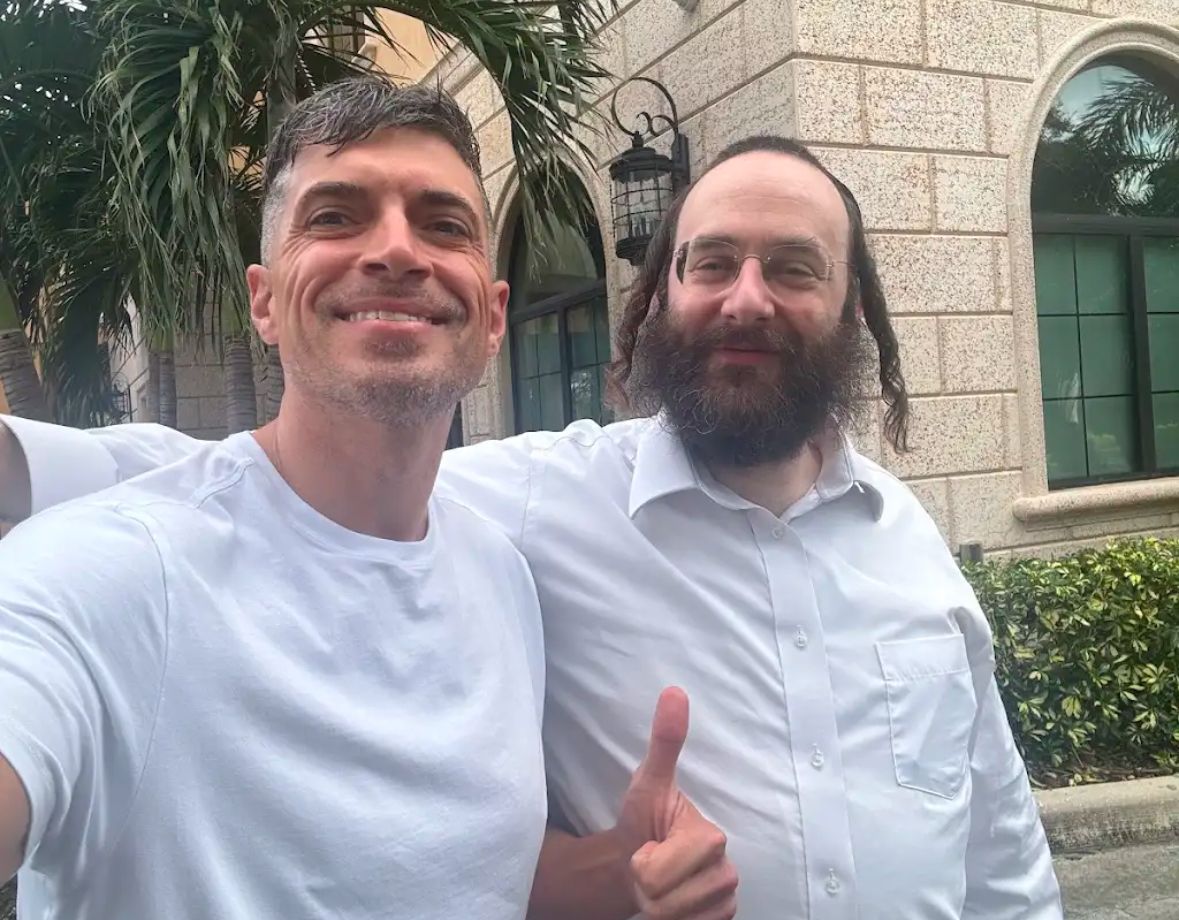 Robert taking a selfie with a happy client