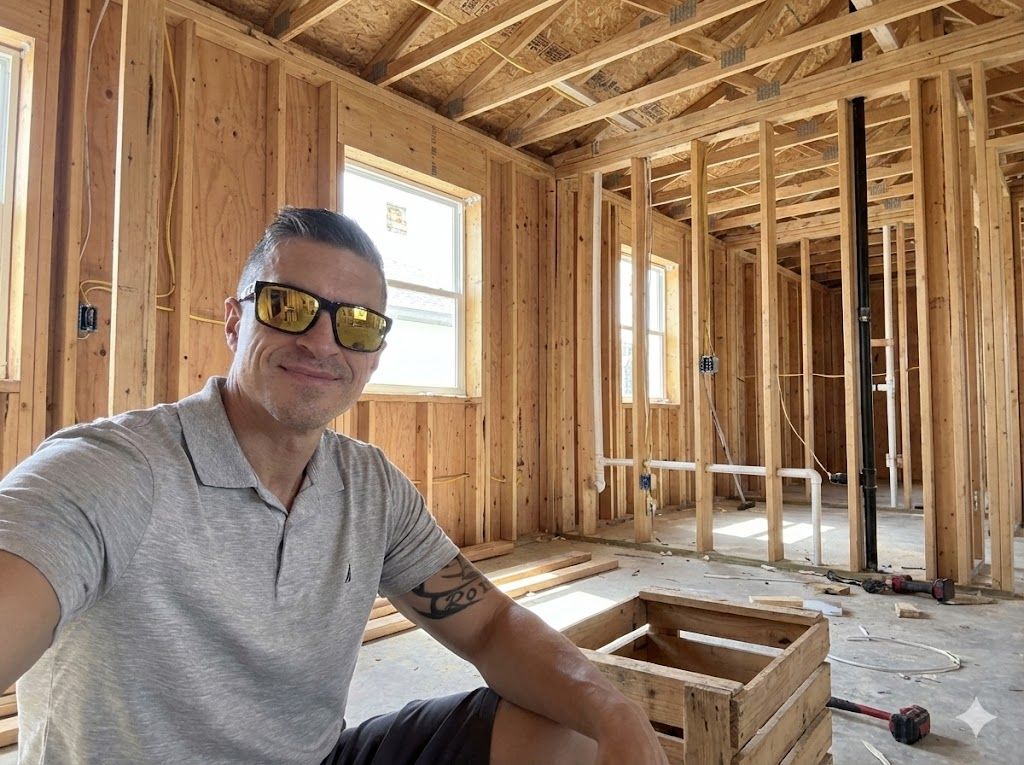 Robert Lunt sitting inside a home under construction during a pre-drywall walk-through